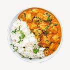 Forest fire recovery: green saplings emerging from charred soil