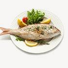 Deer family grazing in forest meadow at dawn