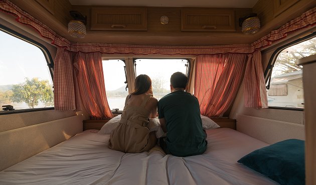 Children dancing barefoot on lawn, grass tickling toes