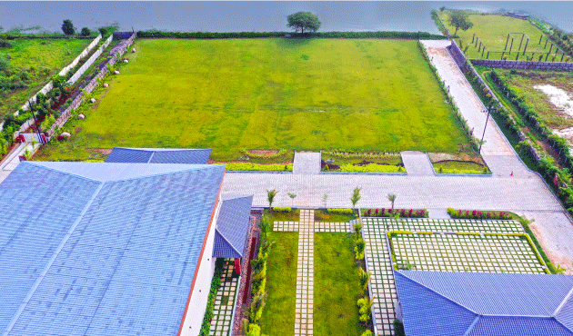 Soft morning mist clinging to lake and lawns, sun just rising