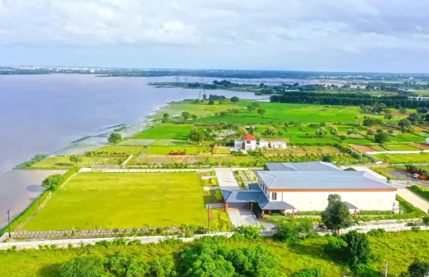 Open-air corridor with arches and lake views, Dhara Resort Hyderabad