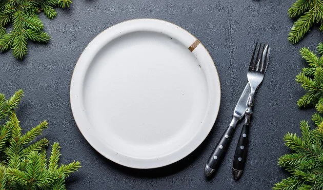 Flower petals scattered on grass — not decoration, but offering