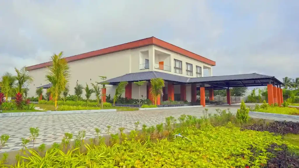 Balcony seating nook with cushioned chairs and lake panorama, Dhara