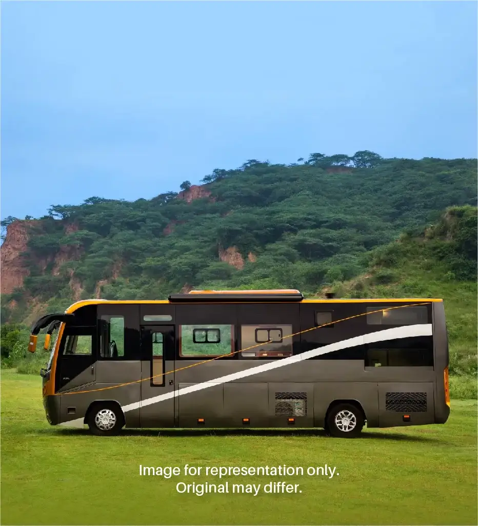 A well-maintained caravan parked at a scenic travel spot, branded with logo suggesting reliable, comfortable road trip and touring services